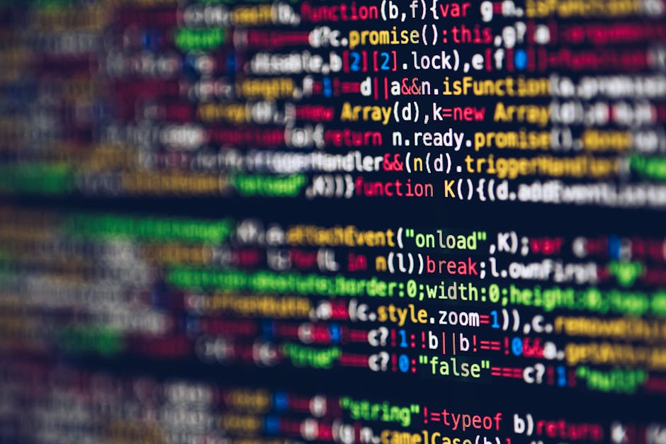 The image shows a close-up view of a computer screen displaying lines of colorful programming code. The code includes various syntax elements such as functions, variables, and control statements, high